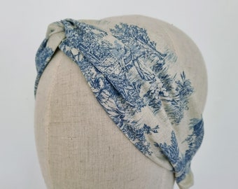 Headband with Toile de Jouy pattern in cherry red, grey, or blue.