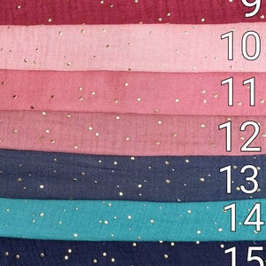 May include: A stack of eight fabric swatches with gold glitter dots. The swatches are in the following colors: black, burgundy, pink, light pink, dark pink, navy blue, teal, navy blue, and light green. The numbers 8 through 16 are printed on the right side of the image.