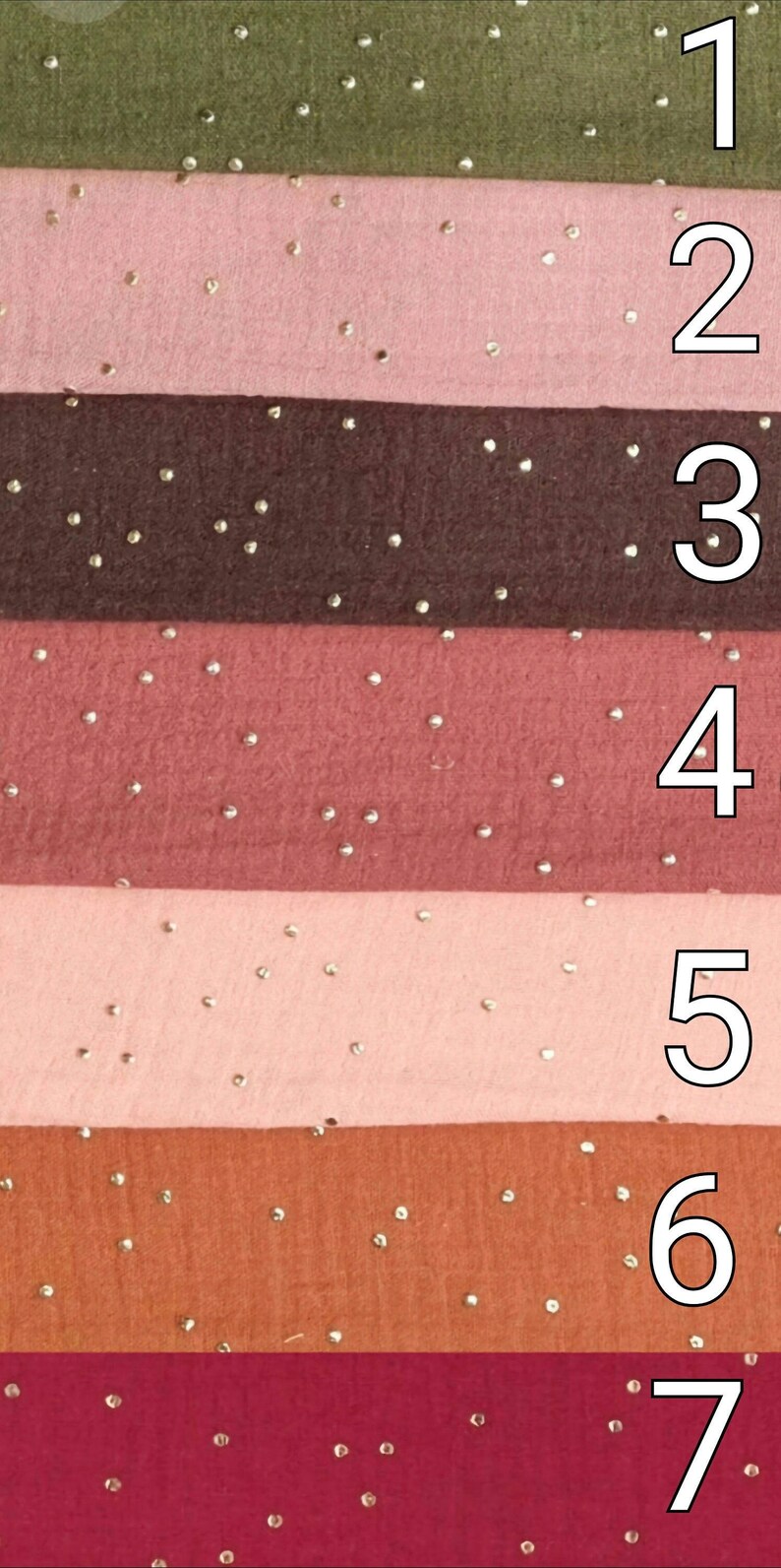 May include: Seven fabric swatches with a subtle sparkle. The swatches are in shades of green, pink, brown, red, light pink, orange, and burgundy.