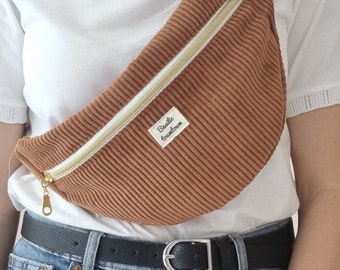 Rust-colored corduroy fanny pack with pocket. Optional exterior pocket