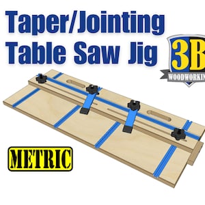 May include: A wooden table saw jig with blue tape and black knobs. The jig is labeled "METRIC" and "Taper/Jointing Table Saw Jig 3B WOODWORKING".