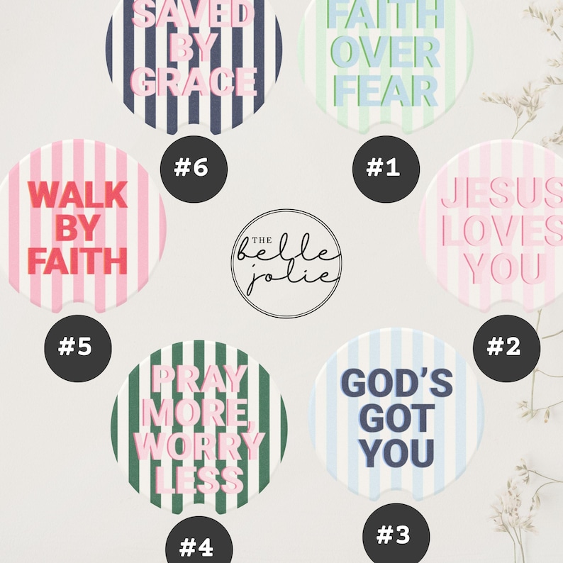 May include: A collection of round car coasters with inspirational phrases like "Faith Over Fear" and "God's Got You." Each coaster features a unique design with stripes and text in various colors, including pink, blue, and green.