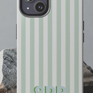 May include: A custom phone case with a vertical striped pattern in light green and white. The case features the initials "SRB" in a matching green color. The text "CUSTOM PHONE CASE" is at the top.