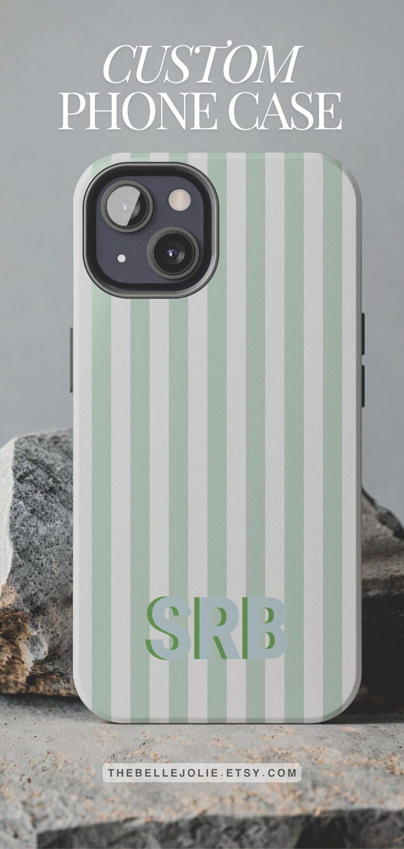 May include: A custom phone case with a vertical striped pattern in light green and white. The case features the initials "SRB" in a matching green color. The text "CUSTOM PHONE CASE" is at the top.