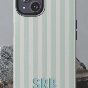 May include: A phone case featuring a vertical striped pattern in light mint green and white. The text CUSTOM MONOGRAM STRIPE appears at the top. The letters SRB are printed in a dark green font near the bottom. The URL THEBELLEJOLIE.ETSY.COM is visible.