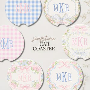 May include: Six round soapstone car coasters featuring various designs including blue and white gingham, pink and white gingham, and floral patterns with bows. Each coaster displays a personalized three-letter monogram in blue or pink.