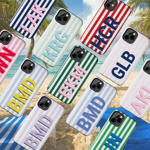 Personalized phone cover with custom monogram initials and pastel pink shadow font design, featuring vertical retro stripe pattern in soft pink and white tones. This chic tough phone case fits multiple iPhone models including iPhone 16, iPhone 15, iPhone 14, and iPhone 13. Ideal as a gift for friends, sisters, or yourself. Perfect for adding a unique touch to your device with a stylish preppy summer vibe. Customize with your favorite colors and initials for a one-of-a-kind look.