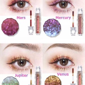 May include: Four different shades of glitter eyeshadow in a crystal-shaped container with a wand applicator. The shades are labeled Mars, Mercury, Jupiter, and Venus.
