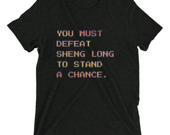 Street Fighter Inspirado - Debes derrotar a Sheng Camiseta larga - Tri-Blend suave y cómoda