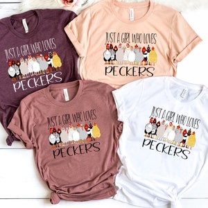 ペッカーズが大好きな女の子のシャツ、クリスマス女性用シャツ、クリスマスTシャツ、ホリデーシャツ、面白い女性用シャツ、女性用かわいいパーティーシャツ