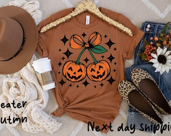 Coquette Bow Pumpkin Shirt,Pumpkin Cheeries Coquette T-Shirt,Halloween Pumpkin Shirt, Spooky Pumpkin Shirt, Fall Girly Sweatshirts