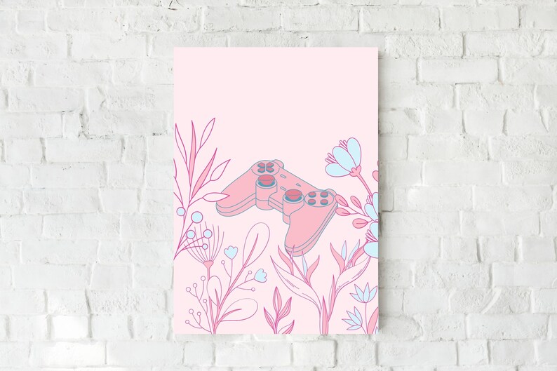 May include: A pink and blue floral art print featuring a video game controller. The controller is in the center of the print, surrounded by pink and blue floral illustrations. The background is a light pink color.