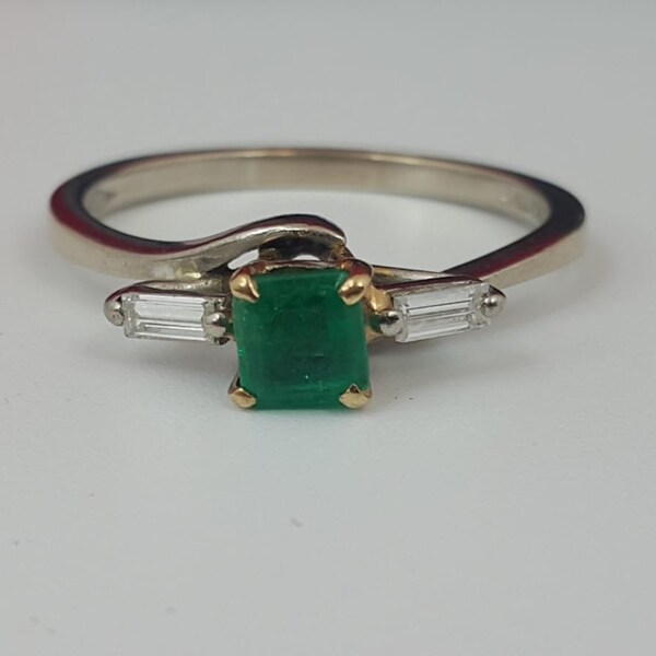 A Gold, Emerald and Diamond ring