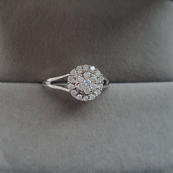 A white Gold & Diamond cluster Engagement Ring