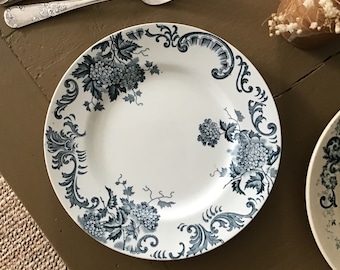 Old flat iron earthenware plate, with superb floral decoration around the edges, blue color on a white background, St Amand