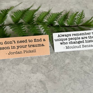 mental health quotes in Kraft brown and white sticker paper strips Slanted on a green fern leaf.