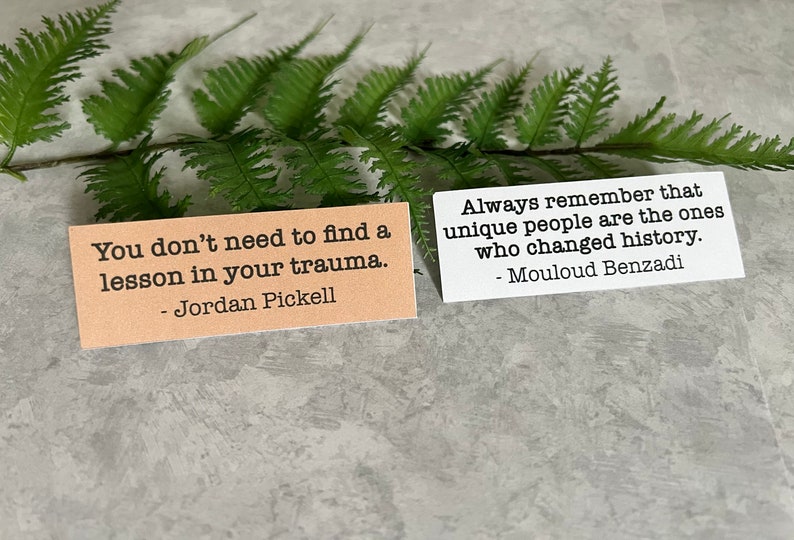 mental health quotes in Kraft brown and white sticker paper strips Slanted on a green fern leaf.
