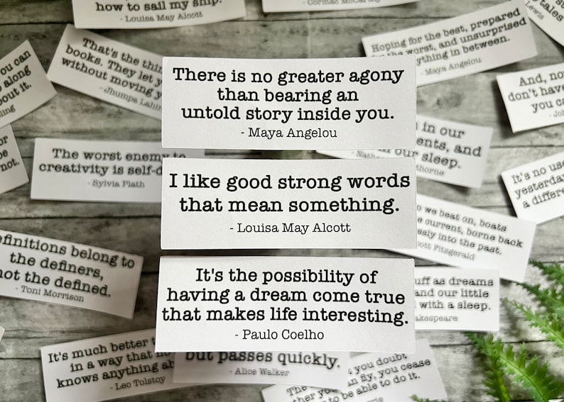 Book quotes by various authors in white sticker paper strips.
