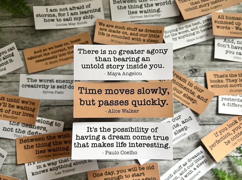 Book quotes by Maya Angelou, Alice Walker, and Paulo Coelho in Kraft brown and white sticker paper strips