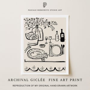 An archival giclée fine art print by Pascale Berkowitz Studio Art, featuring a hand-drawn black-and-white food illustration of a picnic table setting with a fish dish, bread, wine bottles, glasses, and a vase of branches, bordered by a decorative scalloped design.