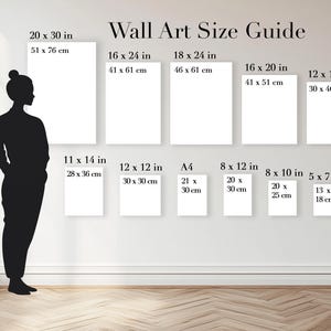 May include: A Wall Art Size Guide chart displaying various rectangular frame dimensions in inches and centimeters. A black silhouette of a person with a height of 5'5" stands next to eleven white rectangles representing different print sizes.