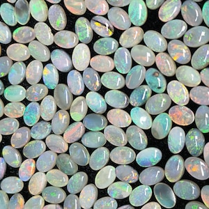 54067.0 - 6x4 mm oval cabochon cut natural australian solid opal whole parcel of 180 pieces weighing 49.53 carats or smaller lots for sale