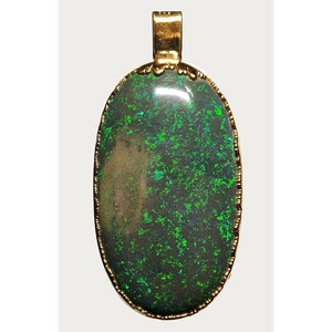 May include: A gold pendant featuring a large oval green opal gemstone. The opal has a dark green base with flashes of iridescent green and blue.