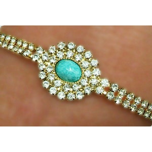 53999.0 - Very Rare 7 x 5 mm Oval Cut Australian Natural Untreated Turquoise in 18 or 19 cm Gold Plated Bracelet with Swarovski Rhinestones
