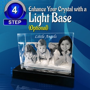 May include: A 3D crystal with a black base, featuring a photo of three children. The crystal is illuminated from below, creating a glowing effect. The text "Little Angels" is visible at the top of the crystal.