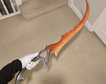 May include: A curved, orange and silver sword with a sharp point and a decorative handle. The sword is held by a hand wearing a white glove.