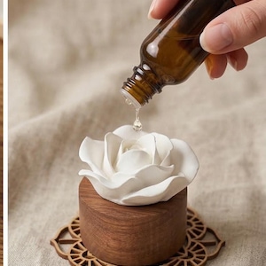 Könnte beinhalten: Ein Set aus drei Keramikbechern mit gesprenkelter, matter Oberfläche. Die Becher sind in den Farben Creme, Hellgrau und Dunkelgrau gehalten. Jeder Becher hat ein schlichtes, minimalistisches Design und einen abgerundeten Henkel.