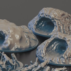 Könnte beinhalten: Drei graue, 3D-gedruckte Höhleneingänge in verschiedenen Formen und Größen. Die Modelle stehen auf einem grauen Hintergrund.