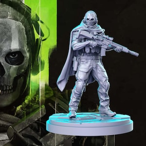 May include: A grey plastic figurine of a masked soldier holding a rifle. The soldier is wearing a hooded cloak and has a skull-like mask. The figurine is standing on a round base.