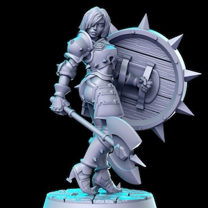 May include: A gray 3D printed miniature of a female warrior figure holding a large axe and a spiked shield. The figure is wearing armor and has a determined expression on her face.