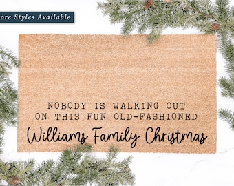 May include: A brown coir doormat with the text "NOBODY IS WALKING OUT ON THIS FUN OLD-FASHIONED Williams Family Christmas" printed in black.