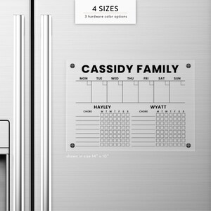 May include: A clear acrylic chore chart with the text "CASSIDY FAMILY" at the top. The chart includes spaces for each day of the week and individual chore lists for Hayley and Wyatt. The chart is shown in a 14" x 10" size.