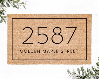 May include: A brown doormat with a black border and the number 2587 and the text "Golden Maple Street" printed on it.