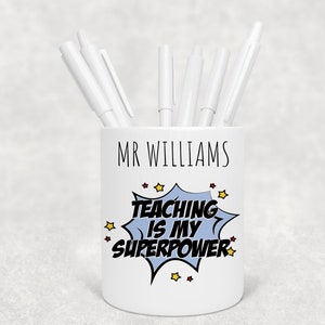May include: White ceramic pencil holder with the text "MR WILLIAMS" and a comic book style graphic that says "TEACHING IS MY SUPERPOWER".