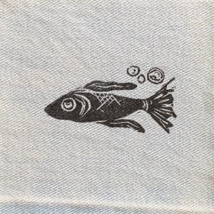 May include: A black and white illustration of a fish swimming with bubbles. The fish has a large eye and a detailed body.