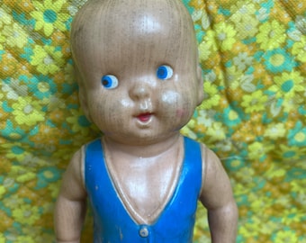 Vintage squeak toy boy doll