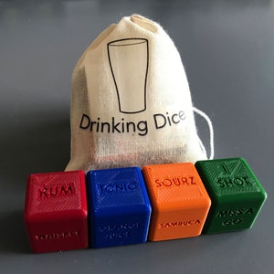 May include: A set of six colourful dice with different drinking game prompts, including "Rum", "Tonic", "Sourz", "1 Shot", "Miss a Go", and "Whiskey", "Orange Juice", "Sambuca". The dice are in a white drawstring bag with the words "Drinking Dice" printed on it.