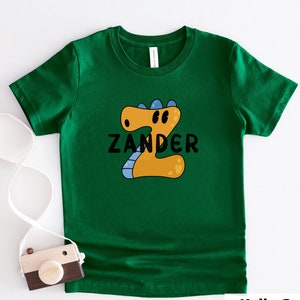 Camisa PERSONALIZADA com letras de dinossauros, primeiro dia de aula, primeiro, segundo, terceiro, camiseta com nome personalizado, dinossauros, crianças, adultos, crianças pequenas, camiseta