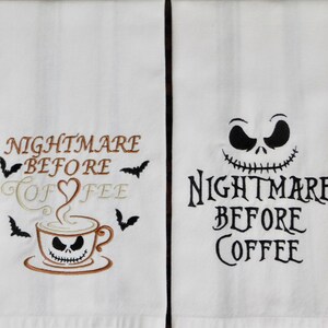 May include: Two white kitchen towels with embroidered Halloween-themed designs. One towel features the phrase "Nightmare Before Coffee" with a coffee cup and bats. The other towel has the phrase "Nightmare Before Coffee" with a Jack Skellington face.