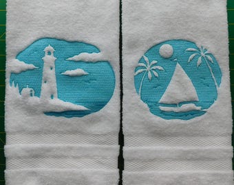 Tropical Lighthouse or Sailboat embossed onto a white hand towel.
