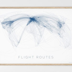 May include: A framed print of a world map with blue lines representing flight routes. The text "FLIGHT ROUTES" is printed below the map.