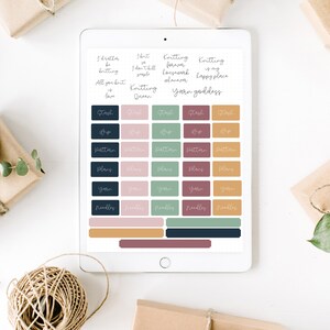May include: A digital tablet screen displaying a set of colorful printable stickers for organizing knitting projects. The stickers feature phrases like "Knitting Forever", "Yarn Goddess", and "Stash", along with icons for yarn, needles, patterns, and plans.