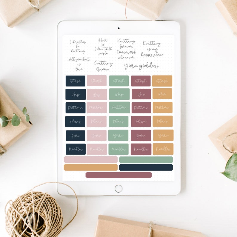 May include: A digital tablet screen displaying a set of colorful printable stickers for organizing knitting projects. The stickers feature phrases like "Knitting Forever", "Yarn Goddess", and "Stash", along with icons for yarn, needles, patterns, and plans.