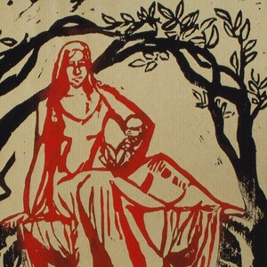 May include: A red and black woodcut print depicting a woman seated and holding a child. The woman is draped in red fabric, and the scene is framed by black tree branches and foliage. The print has a vintage aesthetic.