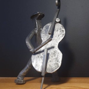 Joueur de violoncelle Railroad Spike
