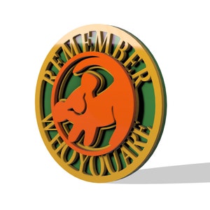 May include: A round, wooden sign with a gold border and a green background. The sign features a silhouette of a lion's head with the words "Remember Who You Are" written around the edge.